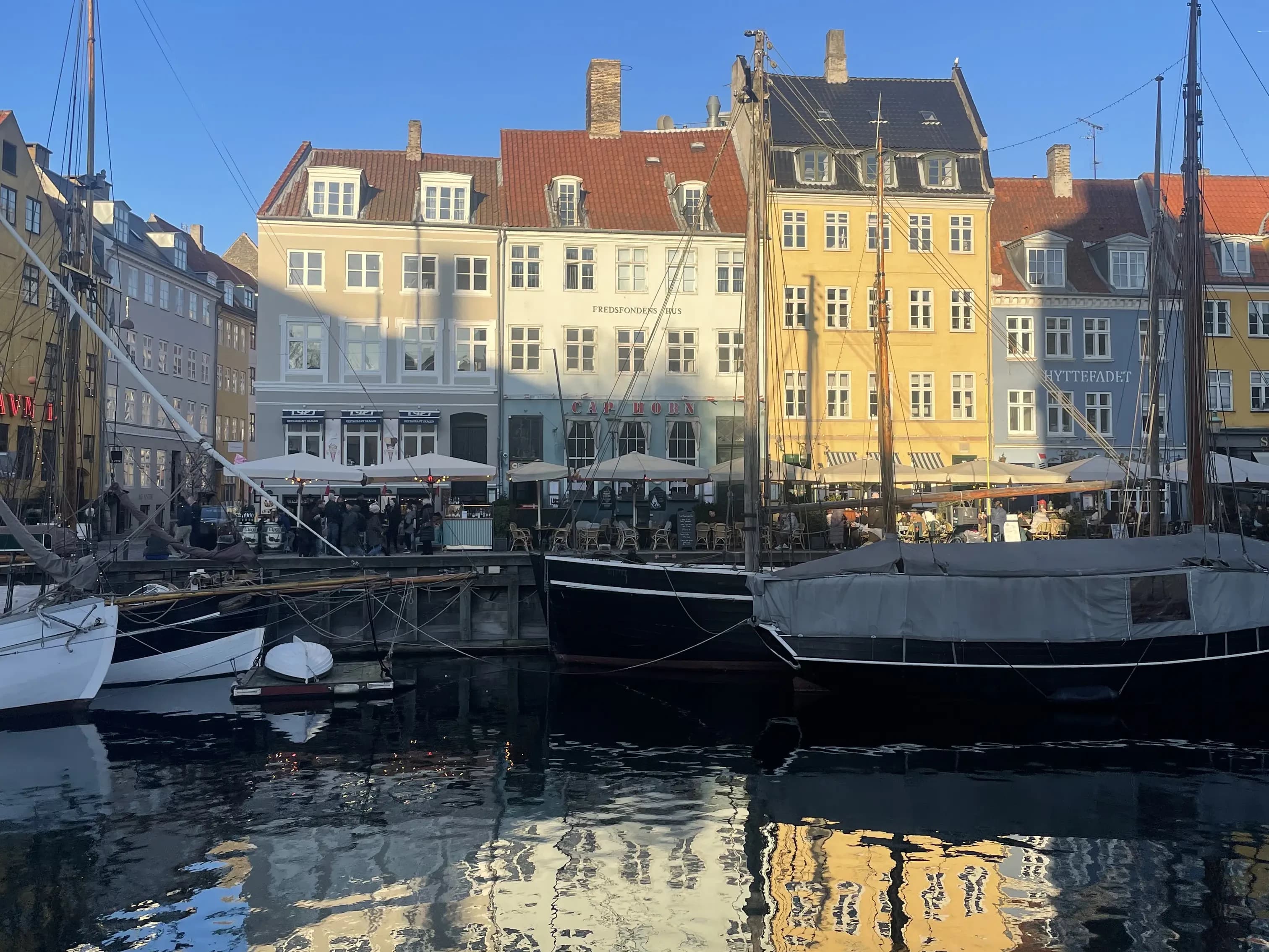 Nyhavn harbor in Copenhagen with colorful buildings and boats